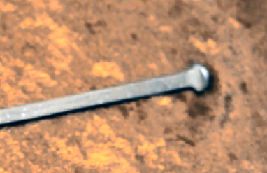 forged button-tip of a foil